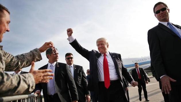 US President Donald Trump reacts as he arrives at Harrisburg international airport, before attending a rally marking his first 100 days in office in Harrisburg, Pennsylvania on Saturday. (Reuters) US President Donald Trump reacts as he arrives at Harrisburg international airport, before attending a rally marking his first 100 days in office in Harrisburg, Pennsylvania on Saturday. (Reuters)