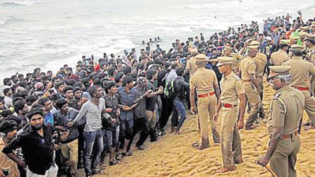 Protestors supporting Jallikattu, a traditional bull-taming ritual, try to form a human chain as police try to remove them from the Marina beach on the Bay of Bengal coast in Chennai, on January 23, 2017.(AP File Photo) Protestors supporting Jallikattu, a traditional bull-taming ritual, try to form a human chain as police try to remove them from the Marina beach on the Bay of Bengal coast in Chennai, on January 23, 2017.(AP File Photo)