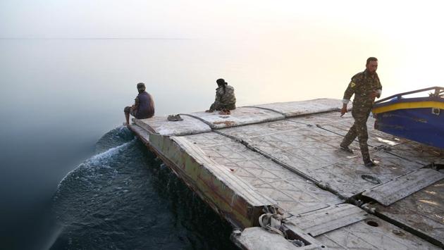 The hour-long trip to the southern shore, where more civilians are waiting to escape, is a sharp contrast with the fierce fighting that awaits SDF forces in Tabqa. (Delil Souleiman/AFP) The hour-long trip to the southern shore, where more civilians are waiting to escape, is a sharp contrast with the fierce fighting that awaits SDF forces in Tabqa. (Delil Souleiman/AFP)