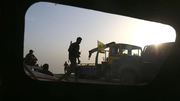 Members of the US-backed Syrian Democratic Forces (SDF), made up of an alliance of Arab and Kurdish fighters, patrol next to boats at the Lake Assad, an enormous reservoir created by the Tabqa dam, as part of their battle for the Islamic State's (IS) stronghold in nearby Raqa. As US-backed fighters advance on the IS group's de facto Syrian stronghold Raqa, a waterway "corridor" has become a key supply line, and an escape route for displaced civilians. (Delil Souleiman/AFP) Members of the US-backed Syrian Democratic Forces (SDF), made up of an alliance of Arab and Kurdish fighters, patrol next to boats at the Lake Assad, an enormous reservoir created by the Tabqa dam, as part of their battle for the Islamic State's (IS) stronghold in nearby Raqa. As US-backed fighters advance on the IS group's de facto Syrian stronghold Raqa, a waterway "corridor" has become a key supply line, and an escape route for displaced civilians. (Delil Souleiman/AFP)
