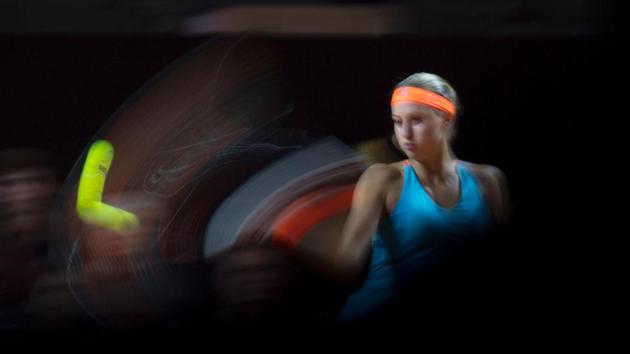 France's Kristina Mladenovic in action against Spain's Carla Suarez Navarro during their quarterfinal match at the WTA Tennis Grand Prix in Stuttgart, south-western Germany, on April 28, 2017. (THOMAS KIENZLE / AFP)