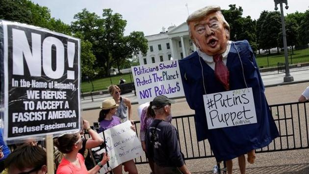 A protester dressed as U.S. President Donald Trump. Many of the protesters carried signs with slogans such as ‘The seas are rising and so are we’ and ‘Don’t be a fossil fool.’ (Joshua Roberts/Reuters)