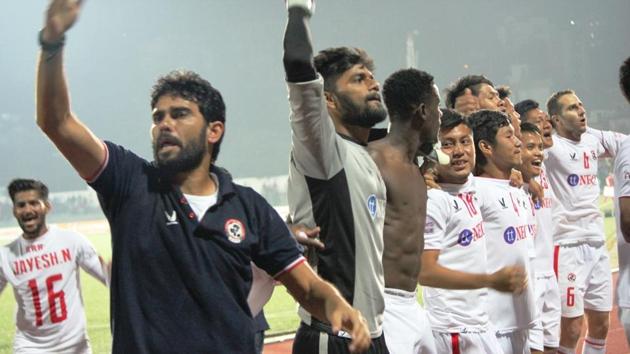 The man behind Aizawl FC’s history-making year in the I-League, their inspirational coach Khalid Jamil (left), celebrates the I-League title victory at the sidelines of the match against Shillong Lajong FC on Sunday. (AIFF) 