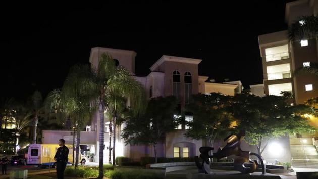 A San Diego police officer stands guard in front a La Jolla apartment building after the shooting on Sunday. (AP Photo) A San Diego police officer stands guard in front a La Jolla apartment building after the shooting on Sunday. (AP Photo)