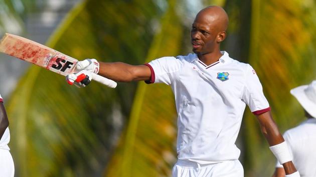 Roston Chase of the West Indies celebrates his century during the 1st day of the 2nd Test match between West Indies and Pakistan at Kensington Oval, Bridgetown, Barbados, on Sunday. Get cricket score of West Indies vs Pakistan, 2nd Test, Day 1 here(AFP)