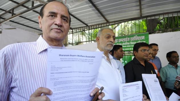 Homebuyers at the Noida authority office, demanding action against realtors. (Sunil Ghosh/HT Photo) Homebuyers at the Noida authority office, demanding action against realtors. (Sunil Ghosh/HT Photo)