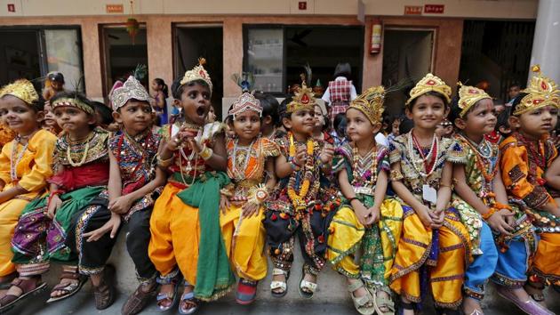 School children dressed as Hindu Lord Krishna, wait for their turn to perform during the celebrations on the eve of Janmashtami festival in Ahmedabad, India.(REUTERS File Photo) School children dressed as Hindu Lord Krishna, wait for their turn to perform during the celebrations on the eve of Janmashtami festival in Ahmedabad, India.(REUTERS File Photo)