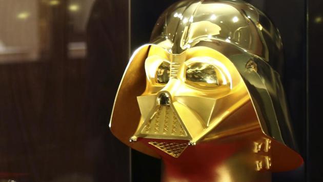 Tokyo gold jeweller Ginza Tanaka's employee looks at the gold mask of Darth Vader at the jewelry shop in Tokyo. (AP) Tokyo gold jeweller Ginza Tanaka's employee looks at the gold mask of Darth Vader at the jewelry shop in Tokyo. (AP)