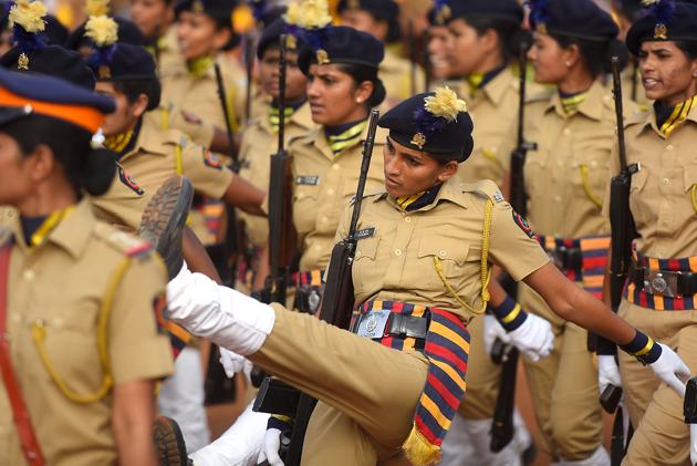FOOT NEAR MOUTH: A policewoman puts her best foot forward. (Pratik Chorge/HT Photo) 