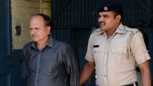 Mahinder Kumar, regional manager of Himachal Road Transport Corporation, arrested in a drug peddling case in Shoghi near Shimla on Monday, May 1. (Deepak Sansta/HT) Mahinder Kumar, regional manager of Himachal Road Transport Corporation, arrested in a drug peddling case in Shoghi near Shimla on Monday, May 1. (Deepak Sansta/HT)