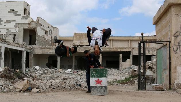 “Parkour makes me a mythical man. It gets us out of the atmosphere of war and makes us forget some of our pain and sorrows, for when i jump from a high place I feel free and i enjoy the fun,’ Muhammad says. (Alaa Al-Faqir / Reuters) “Parkour makes me a mythical man. It gets us out of the atmosphere of war and makes us forget some of our pain and sorrows, for when i jump from a high place I feel free and i enjoy the fun,’ Muhammad says. (Alaa Al-Faqir / Reuters)