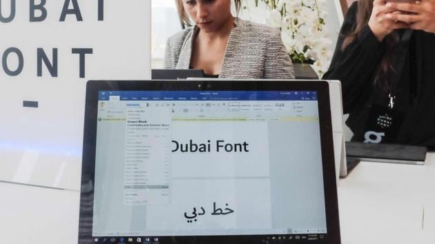 Attendees look at computers showing the "Dubai Font", the first typeface developed by Microsoft for Dubai, during a conference to announce its launch on April 30.(AFP Photo)