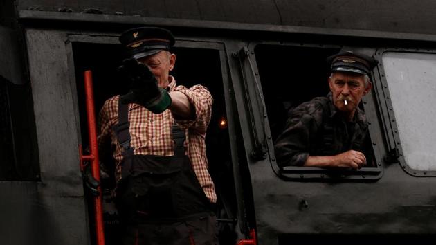 An engine driver waves after the Parade. (Kacper Pempel /REUTERS)