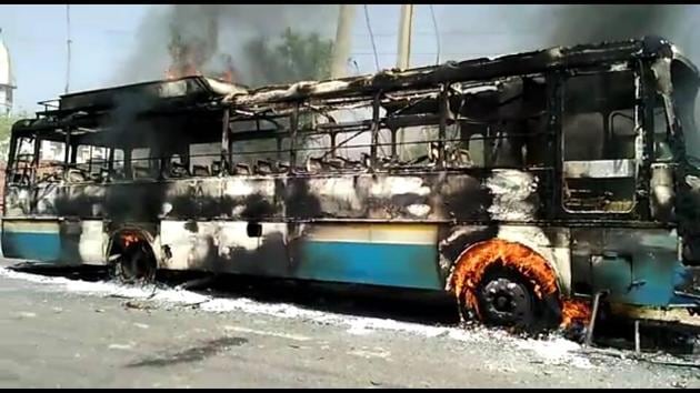 The Haryana Roadways bus torched by angry protesters after it crushed a Class12 student in Achina Tal village of Charkhi Dadri district on Monday.(Manoj Dhaka/HT Photo) The Haryana Roadways bus torched by angry protesters after it crushed a Class12 student in Achina Tal village of Charkhi Dadri district on Monday.(Manoj Dhaka/HT Photo)