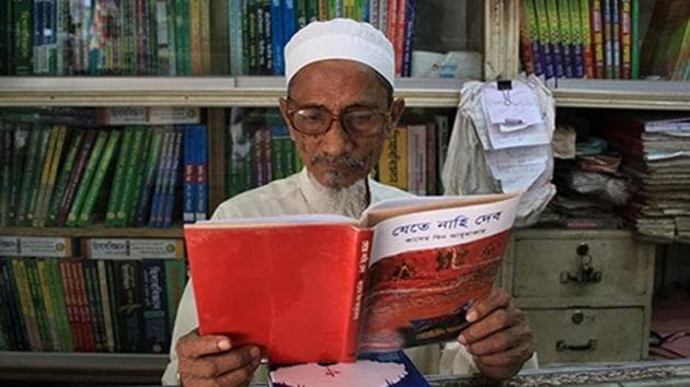 Bangladeshi novelist Kasem bin Abubakar poses for a photograph with a copy of one of his books at his book shop in Dhaka.(AFP) Bangladeshi novelist Kasem bin Abubakar poses for a photograph with a copy of one of his books at his book shop in Dhaka.(AFP)