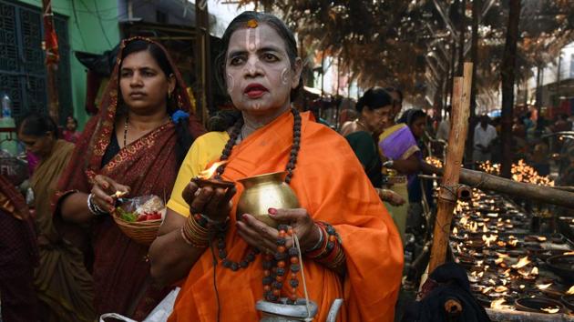 A lady devotee takes part in the procession of the deity.