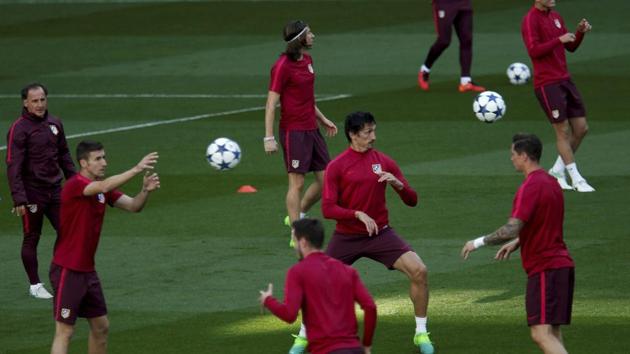 Atletico Madrid players during a training session at the Santiago Bernabeu stadium on Tuesday morning, just hours ahead of their UEFA Champions League first leg semifinal match against Real Madrid C.F.(AP)