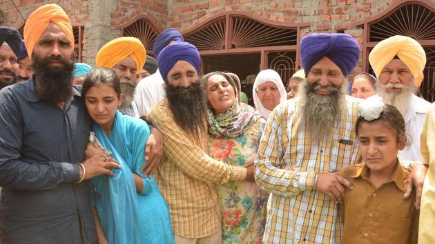 Martyr Paramjit Singh’s family and fellow villagers grieve at their house in Vein Poin village in Tarn Taran district on Tuesday, May 2. Pakistani forces killed two Indian soldiers and mutilated their bodies along the Line of Control on May 1. (Sameer Sehgal/HT)