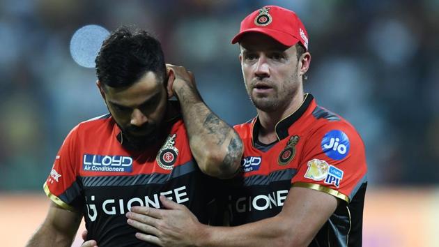 Royal Challengers Bangalore captain Virat Kohli and AB De Villiers had different advice for bowler Aniket Choudhury when he came to bowl in the 18th over against Mumbai Indians.(AFP) Royal Challengers Bangalore captain Virat Kohli and AB De Villiers had different advice for bowler Aniket Choudhury when he came to bowl in the 18th over against Mumbai Indians.(AFP)