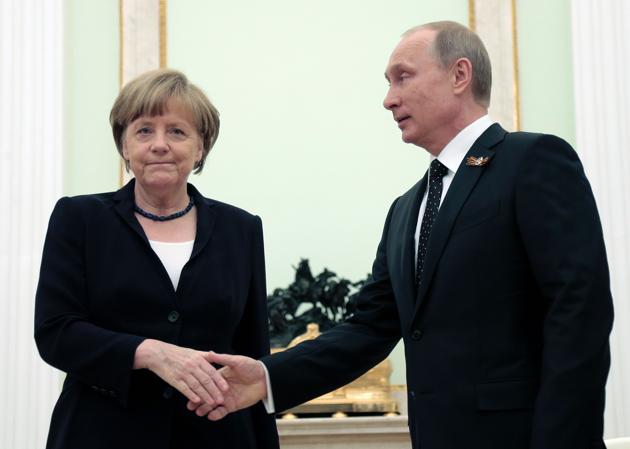 File photo of Vladimir Putin and Angela Merkel during their meeting at the Kremlin in May 2015.(AFP)