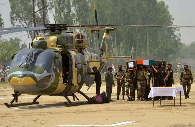 Indian Army personnel carry the coffin of Indian Army soldier Paramjeet Singh ahead of his funeral at Vein Pein village. The Indian army accused Pakistan of killing two of its soldiers and mutilating their bodies in an "unprovoked" rocket and mortar attack along the tense border which separates the two countries. (Narinder Nanu/AFP) Indian Army personnel carry the coffin of Indian Army soldier Paramjeet Singh ahead of his funeral at Vein Pein village. The Indian army accused Pakistan of killing two of its soldiers and mutilating their bodies in an "unprovoked" rocket and mortar attack along the tense border which separates the two countries. (Narinder Nanu/AFP)