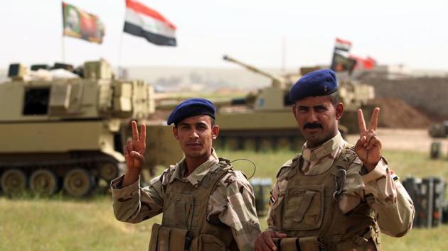 Iraqi soldiers gesture on the frontline in the village of Huleileh, north of Mosul on May 1, 2017, during an offensive to retake the area from Islamic State (IS) group fighters. (AFP Photo) Iraqi soldiers gesture on the frontline in the village of Huleileh, north of Mosul on May 1, 2017, during an offensive to retake the area from Islamic State (IS) group fighters. (AFP Photo)