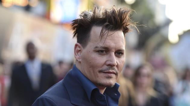 Johnny Depp arrives at the premiere of Alice Through the Looking Glass at the El Capitan Theatre in Los Angeles.(Jordan Strauss/Invision/AP)