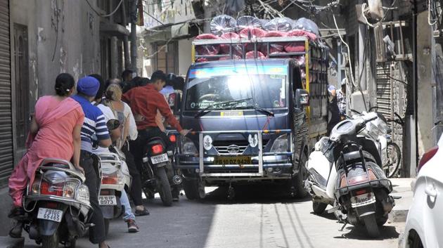 A mini truck carrying goods stuck in a narrow street in Subhash Nagar area in Ludhiana.