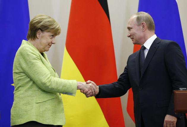 Russian President Vladimir Putin and German Chancellor Angela Merkel at a conference in Sochi on Tuesday. (Reuters) Russian President Vladimir Putin and German Chancellor Angela Merkel at a conference in Sochi on Tuesday. (Reuters)