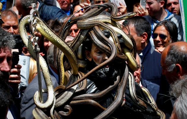 Every year in May, snakes are placed onto the statue of St. Domenico and the statue is then carried in a procession around the town. (Tony Gentile / Reuters)