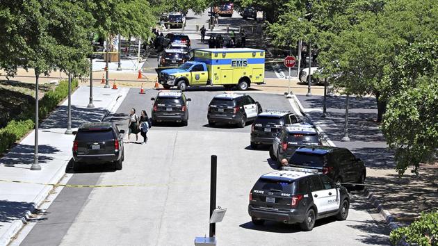 Law enforcement officers secure the scene after a fatal stabbing attack on the University of Texas campus.(AP)