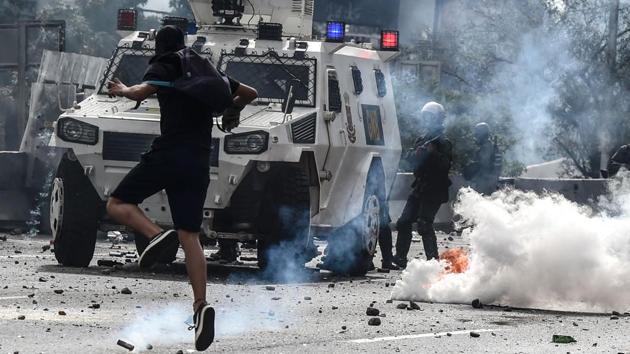 Venezuela's beleaguered President Nicolas Maduro on Monday called for a new constitution, to be written by a ‘people's’ body circumventing the opposition-held Congress. The decree was to ‘block the fascist coup’ threatening the country, he told thousands of supporters in Caracas at a May Day rally. (Juan BARRETO / AFP)