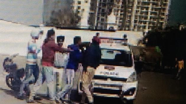 Video grabs of the youths thrashing the PCR constable near Gurdwara Singh Shaheedan in Sohana, SAS Nagar.(HT Photo)