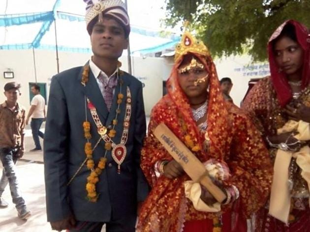 A mass-marriage ceremony was hosted by Gopal Bhargava, state minister of panchayati raj and rural development, in his hometown of Garhakota on Saturday. Bhargava made sure the messages were inscribed loud and clear on the traditional laundry bats used to thrash the grime out of dirty clothes: ‘A gift to be used for bashing drunkards’ and ‘The police won’t intervene!”(HT Photo)