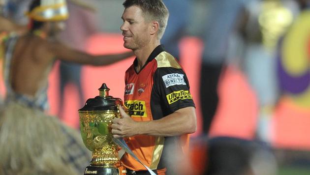 Sunrisers Hyderabad captain David Warner carries the trophy during the opening ceremony of the 2017 Indian Premier League at the Rajiv Gandhi International Cricket Stadium in Hyderabad on April 5, 2017.(AFP)