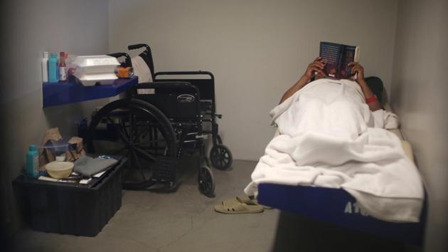 An ICE detainee lies in his cell in the segregation wing . (Lucy Nicholson /Reuters)