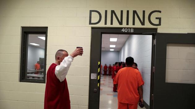 ICE detainees walk into the dining area for lunch. (Lucy Nicholson /Reuters)