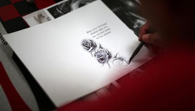 An ICE detainee draws roses on a birthday card. (Lucy Nicholson /Reuters)