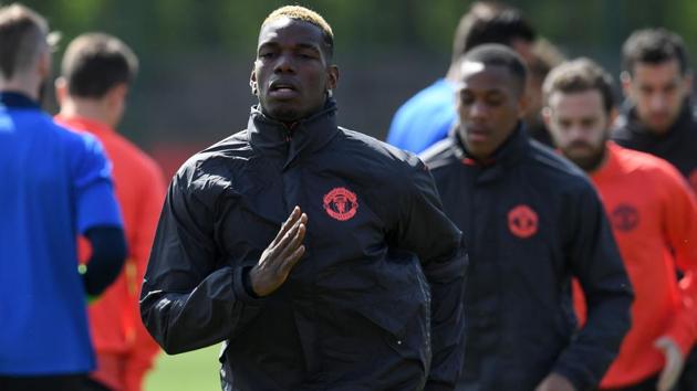 Manchester United midfielder Paul Pogba (C) and Anthony Martial (centre R) attend a team training session against Celta Vigo. (AFP) Manchester United midfielder Paul Pogba (C) and Anthony Martial (centre R) attend a team training session against Celta Vigo. (AFP)