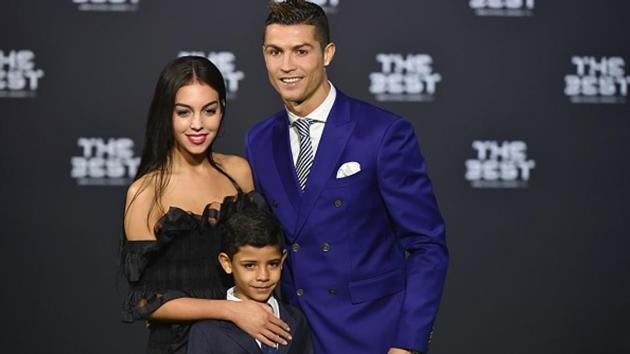 Cristiano Ronaldo poses with partner Georgina Rodriguez and his son Cristiano Ronaldo Jr as they arrive for The Best FIFA Football Awards 2016 ceremony, on January 9, 2017 in Zurich. (AFP/Getty Images) Cristiano Ronaldo poses with partner Georgina Rodriguez and his son Cristiano Ronaldo Jr as they arrive for The Best FIFA Football Awards 2016 ceremony, on January 9, 2017 in Zurich. (AFP/Getty Images)