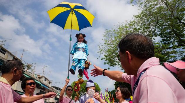 Real buns are no longer used to create the bun tower. (Anthony Wallace/AFP) 