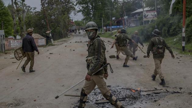 Indian policemen clear the area after a protest in Budgam, about 20 km southwest of Srinagar. (AP) Indian policemen clear the area after a protest in Budgam, about 20 km southwest of Srinagar. (AP)
