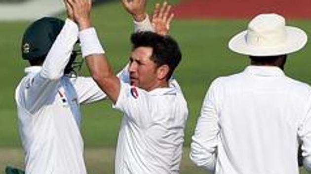 Yasir Shah (middle) took six wickets for Pakistan against the West Indies on Day 4 of the second Test at Barbados. Catch full cricket score of West Indies vs Pakistan here(Getty Images)