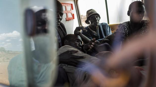 A man suffering from cholera is taken by ambulance to the Mingkaman temporary hospital. (AFP)