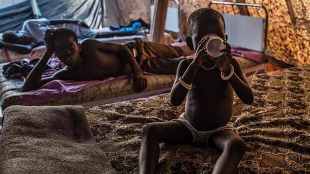 A child suffering from cholera drinks water at a specialized hospital.The cholera outbreak will ‘intensify and spread during the upcoming rainy season due to continued conflict,’ a UN humanitarian report said. (AFP)