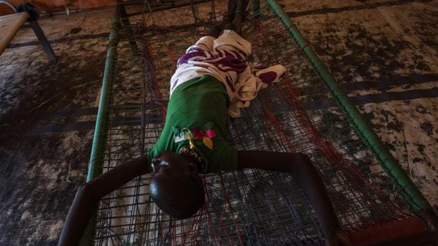 A young South Sudanese suffering from cholera rests at a hospital.Cholera is caused by the bacterium Vibrio cholerae, which causes the cells lining the intestine to produce large amounts of fluid, leading to violent diarrhoea and vomiting. (AFP)