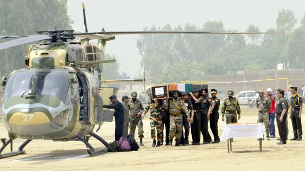 Indian Army personnel carry the coffin of Indian Army soldier Paramjeet Singh ahead of his funeral at Vein Pein village, some 45kms from Amritsar on May 2, 2017. The Indian army accused Pakistan of killing two of its soldiers and mutilating their bodies in an 'unprovoked' rocket and mortar attack along the border on Monday morning.(Sameer Sehgal/Hindustan Times) Indian Army personnel carry the coffin of Indian Army soldier Paramjeet Singh ahead of his funeral at Vein Pein village, some 45kms from Amritsar on May 2, 2017. The Indian army accused Pakistan of killing two of its soldiers and mutilating their bodies in an 'unprovoked' rocket and mortar attack along the border on Monday morning.(Sameer Sehgal/Hindustan Times)