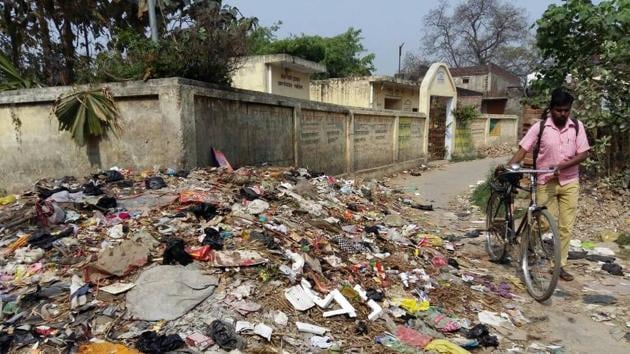 Mounds of garbage are piled up on either side of narrow streets that residents say haven’t been swept in days.(HT Photo)