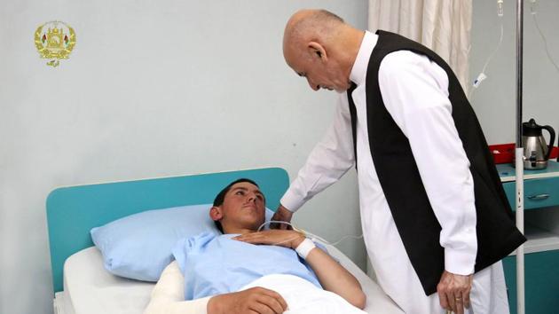 File photo of Afghan President Ashraf Ghani talking with a victim wounded in the April 21 attack on an army base in Mazar-e-Sharif. (Reuters) File photo of Afghan President Ashraf Ghani talking with a victim wounded in the April 21 attack on an army base in Mazar-e-Sharif. (Reuters)