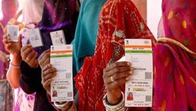 Rajasthani women show their Aadhaar cards while standing in a queue to vote in the Ajmer District Panchayat elections.(PTI) Rajasthani women show their Aadhaar cards while standing in a queue to vote in the Ajmer District Panchayat elections.(PTI)